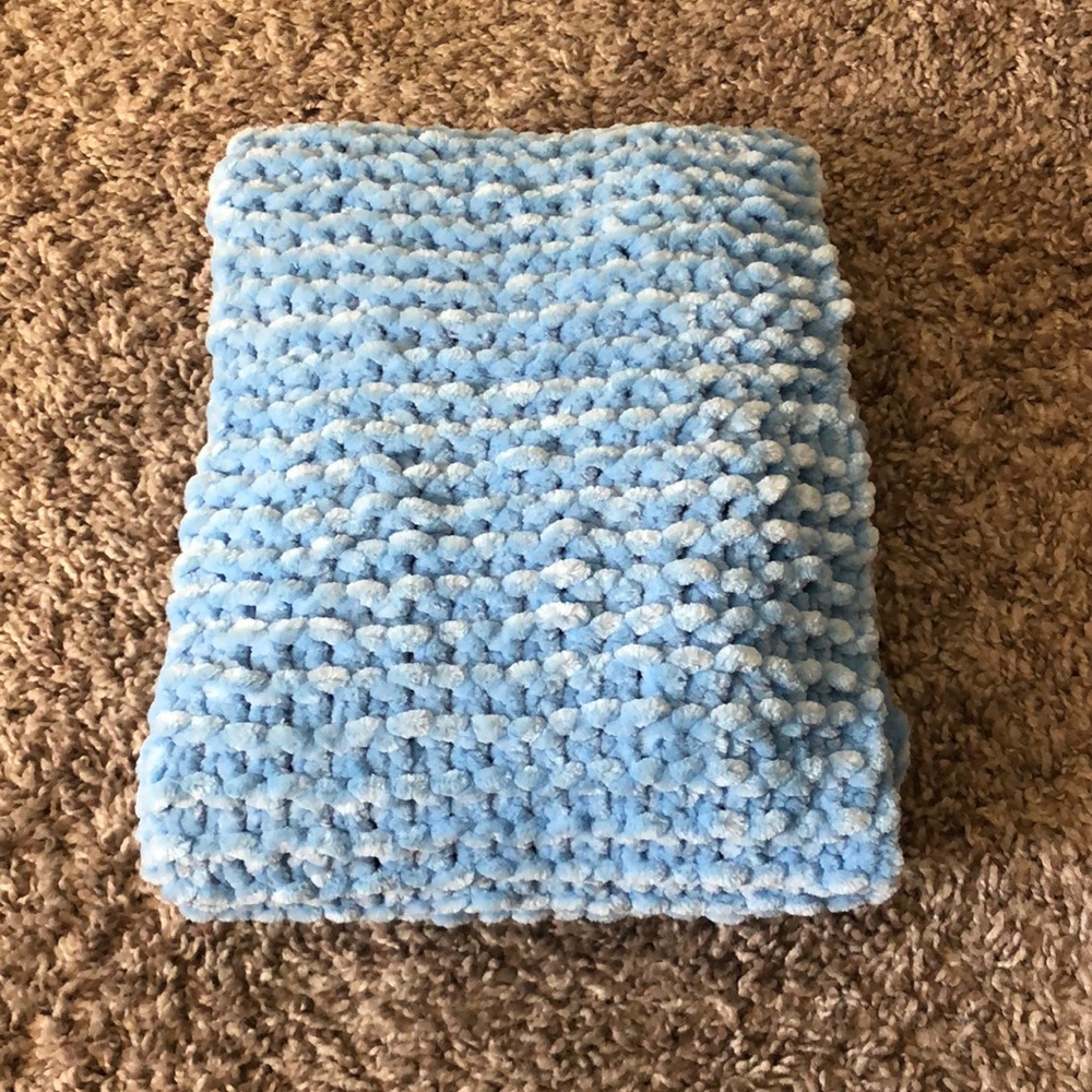 Hand knitted sky blue scarf. I use Yarn Bee